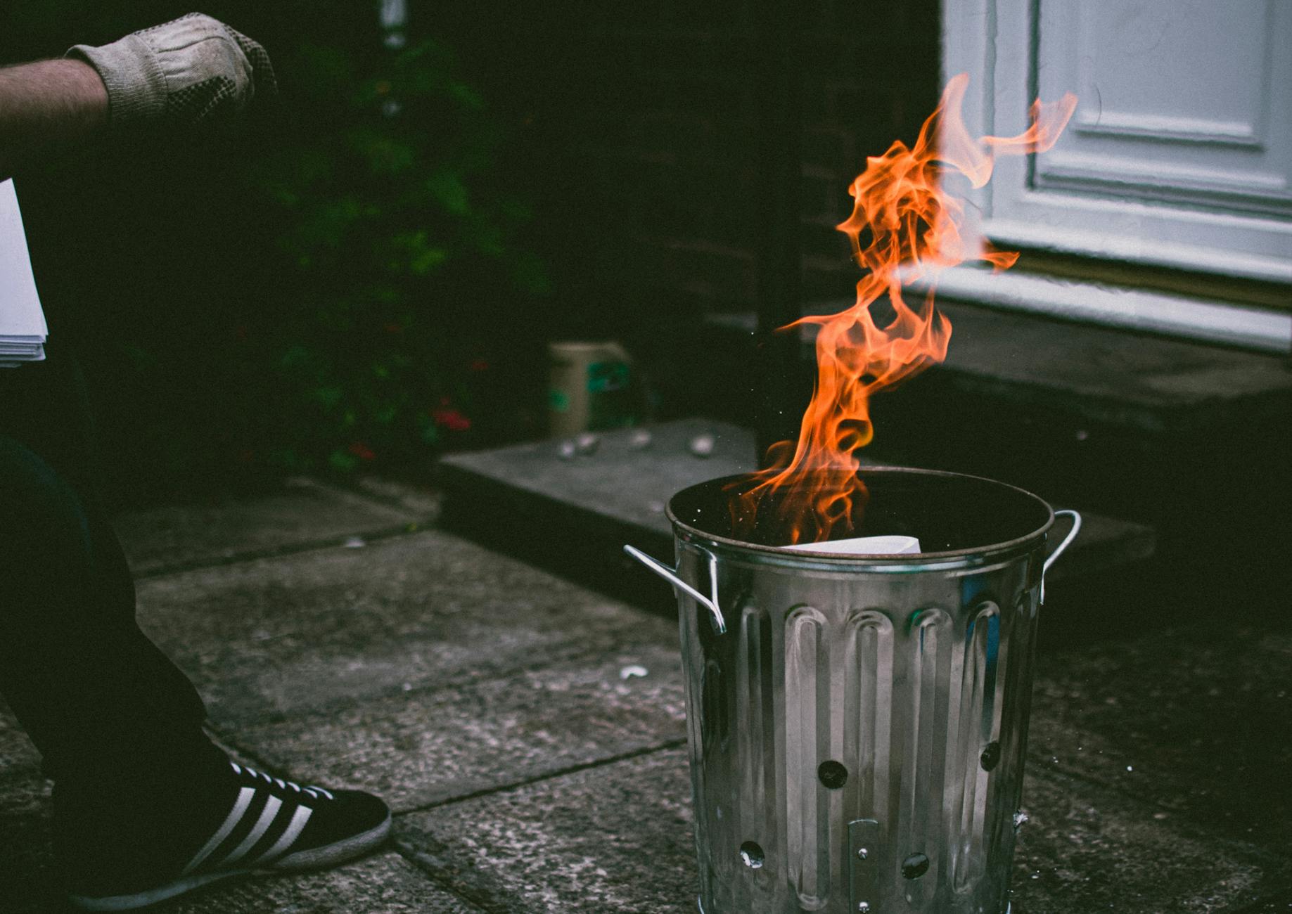stainless steel trash can on fire