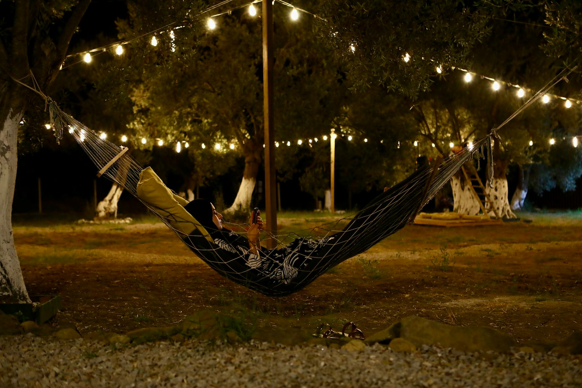 cozy evening in a lit hammock outdoors