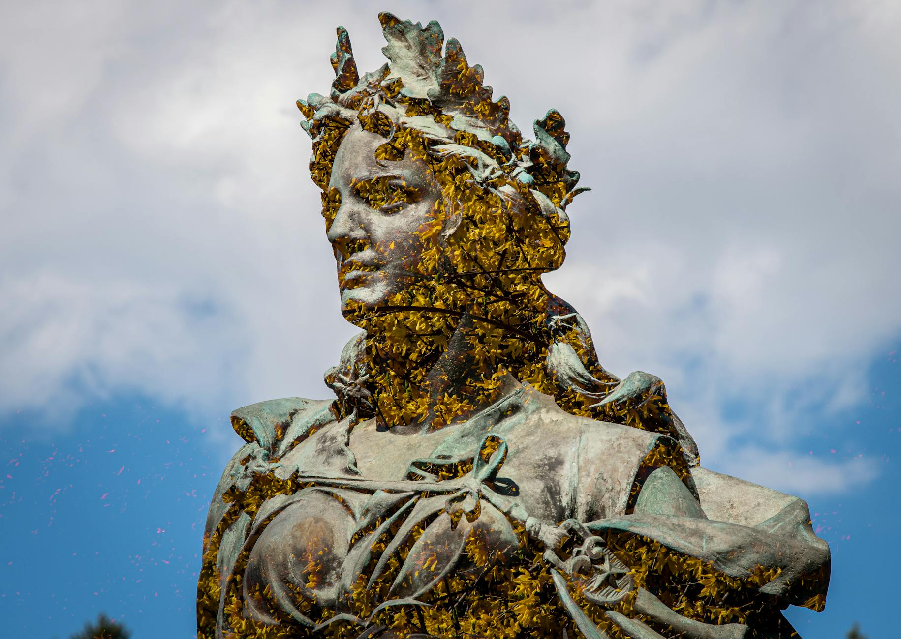 majestic bronze statue against blue sky